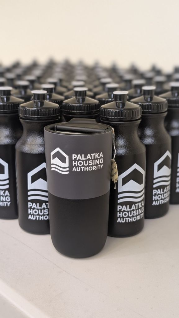 Palatka Housing Authority branded reusable water bottles arranged together