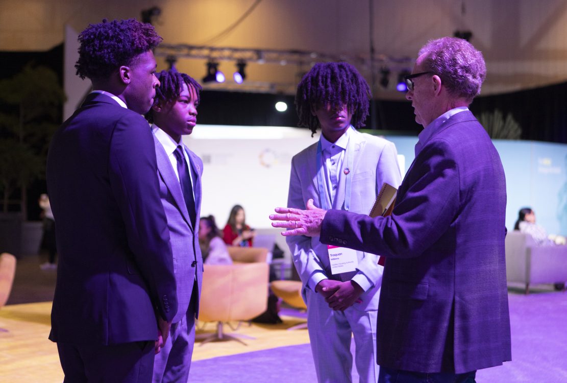 Palatka Housing Authority representatives speaking with community members at an event